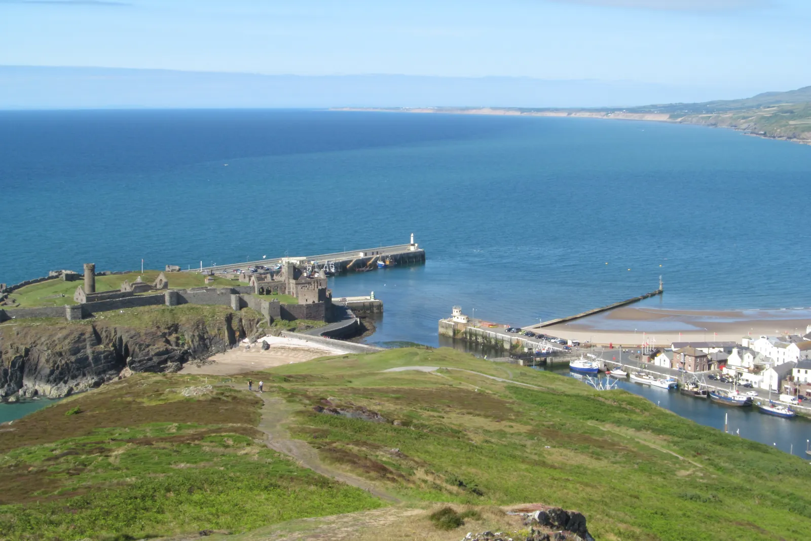 Peel Castle on St Patrick's Isle above Peel harbour and beach